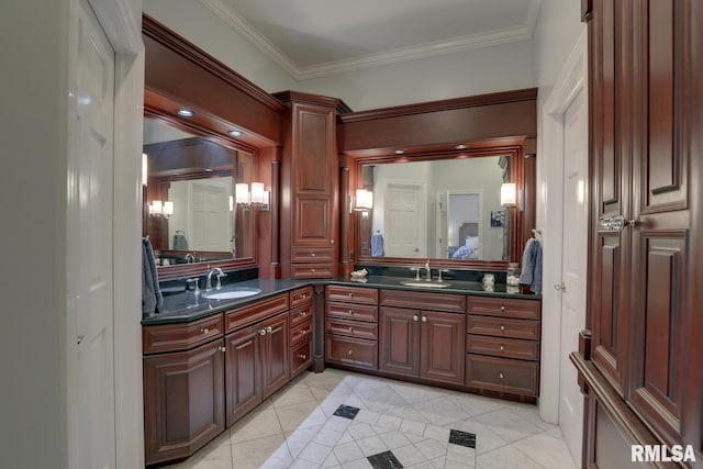 bathroom featuring vanity, crown molding, and tile patterned floors