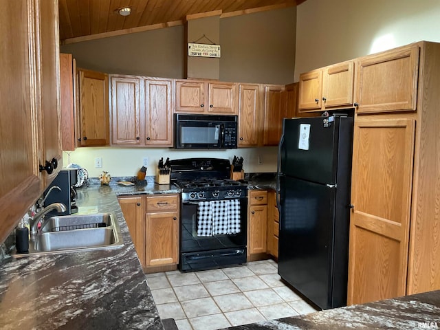 kitchen featuring black appliances, dark stone counters, wood ceiling, sink, and light tile floors