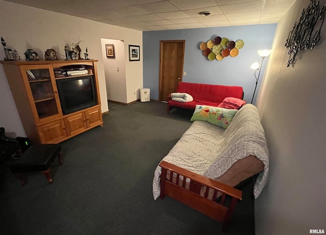 carpeted living room with a drop ceiling