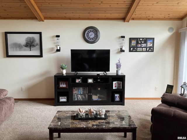 living room featuring beamed ceiling, carpet, and wood ceiling