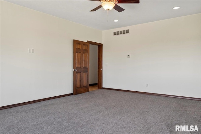 carpeted empty room with ceiling fan