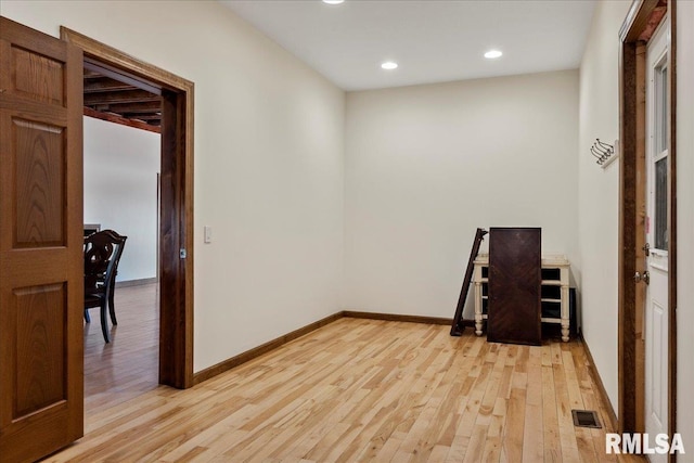 empty room with light hardwood / wood-style floors