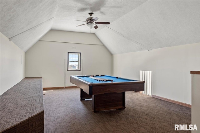 game room with a textured ceiling, vaulted ceiling, billiards, ceiling fan, and dark carpet