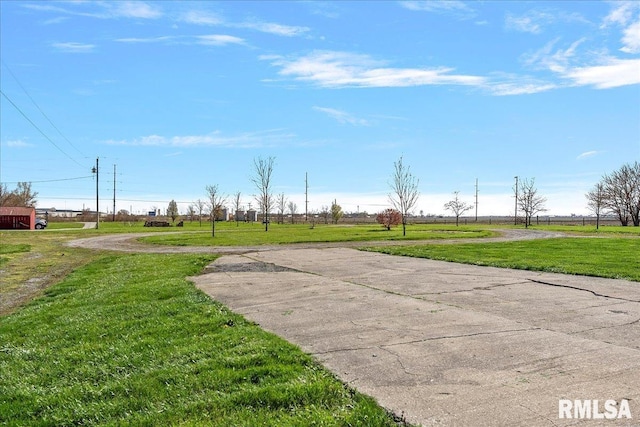 view of home's community with a yard