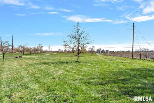 view of yard with a rural view