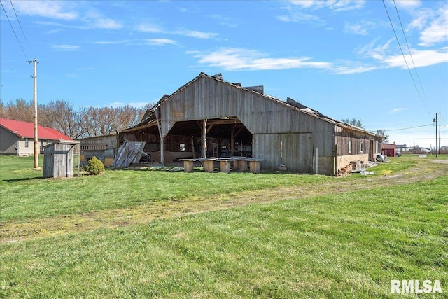 exterior space with a yard and an outdoor structure