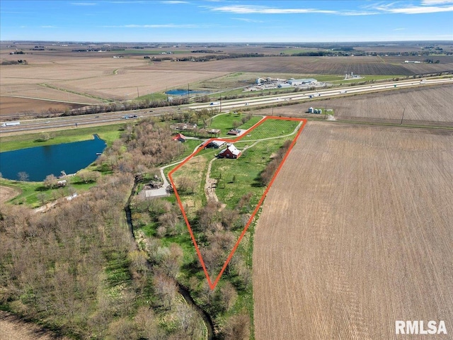 birds eye view of property with a rural view and a water view