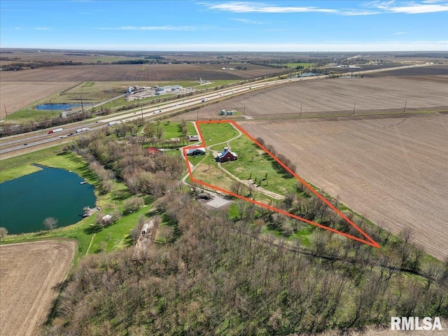 birds eye view of property featuring a rural view and a water view