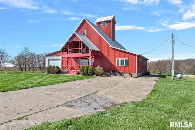 view of front of property featuring a garage and a front lawn