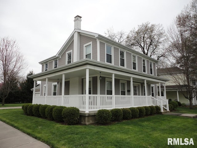 country-style home with covered porch and a front yard