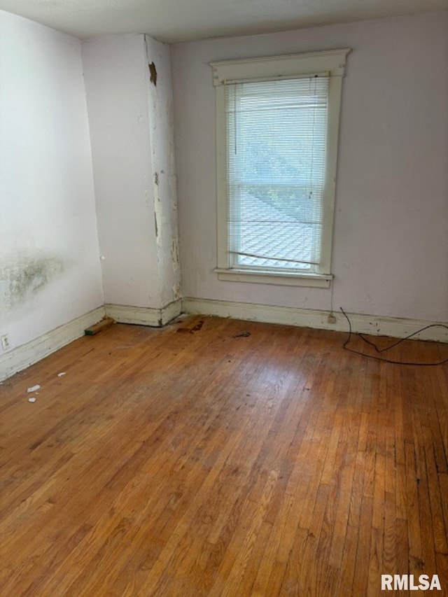 spare room featuring hardwood / wood-style flooring