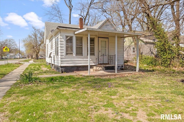 bungalow with a front yard