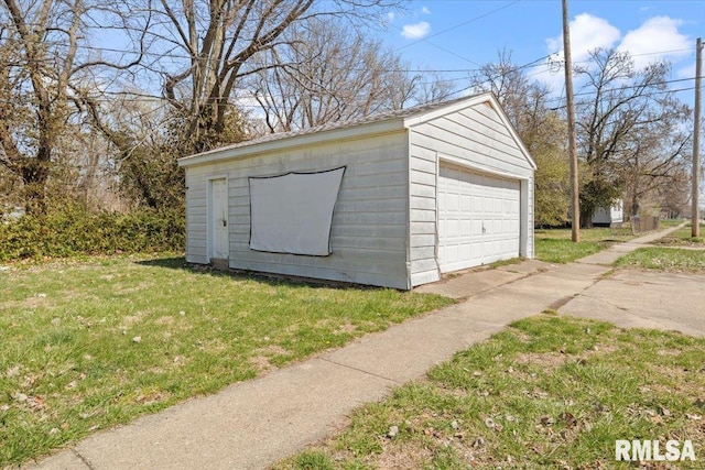 garage featuring a lawn