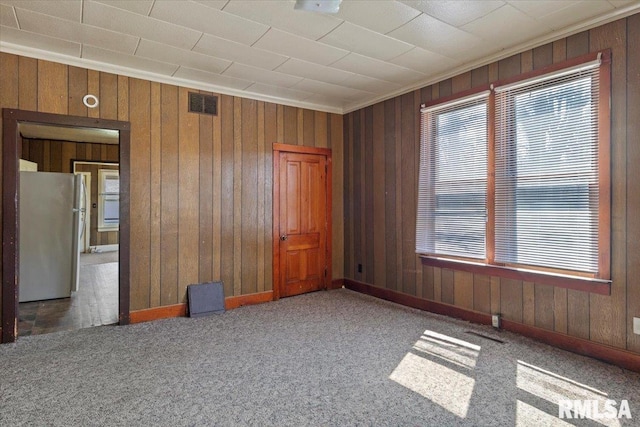 carpeted empty room with crown molding