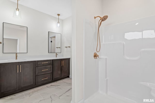 bathroom with a shower and vanity