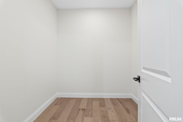 empty room with light hardwood / wood-style flooring