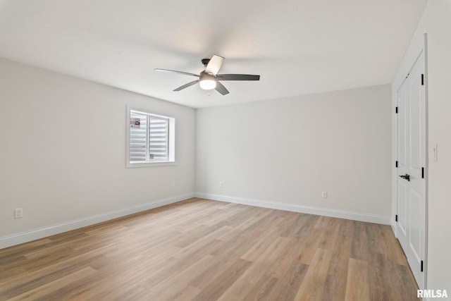 unfurnished room featuring light wood-type flooring and ceiling fan