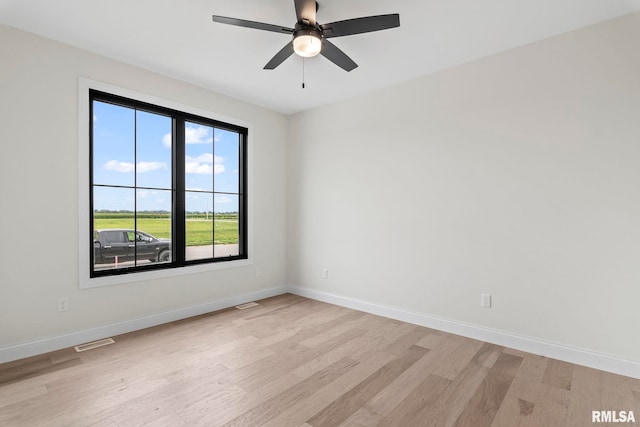 unfurnished room with ceiling fan and light hardwood / wood-style floors