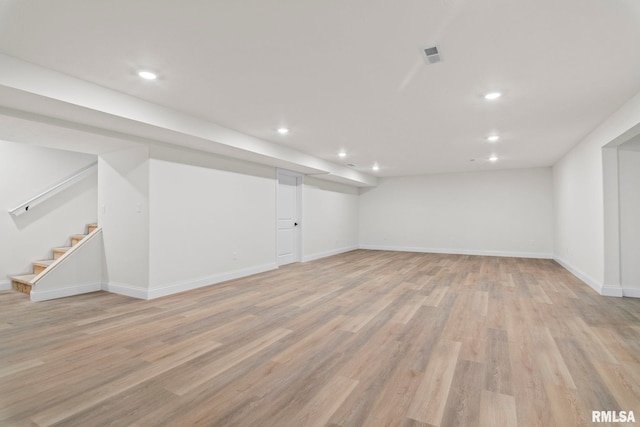 basement featuring light hardwood / wood-style flooring