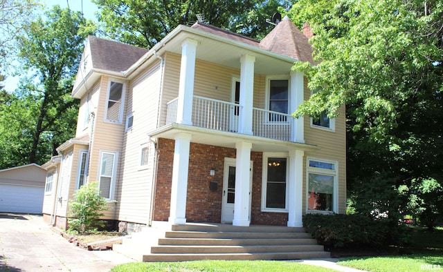 view of front of home with an outdoor structure and a garage