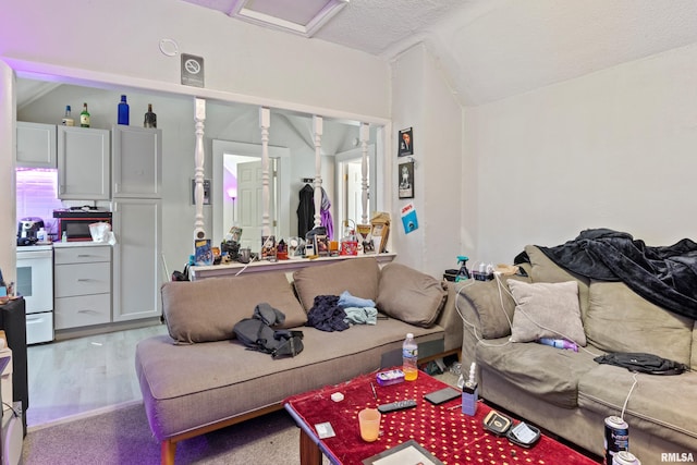 interior space featuring a textured ceiling and light hardwood / wood-style flooring