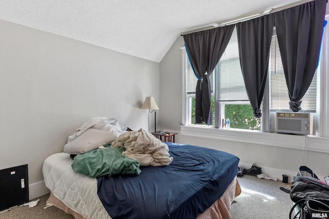 bedroom featuring a textured ceiling, cooling unit, vaulted ceiling, and carpet