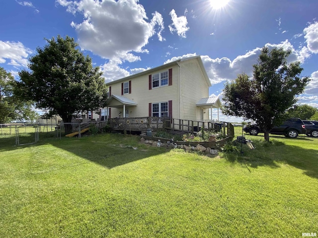 view of yard with fence and a deck