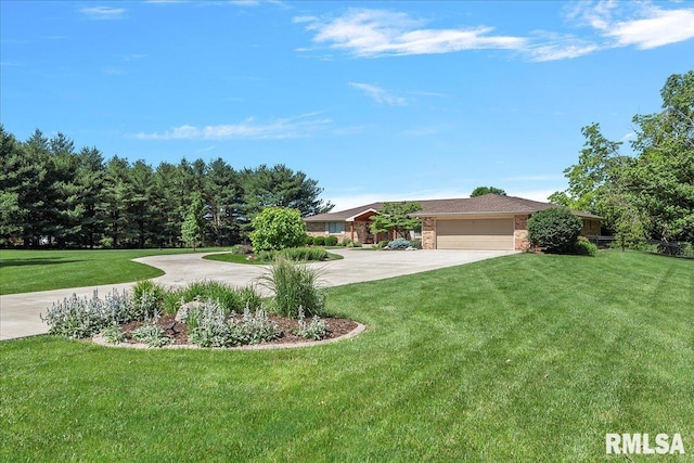 view of front of property with a front yard and a garage