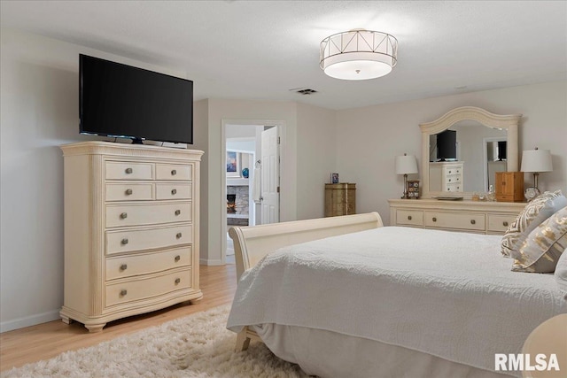 bedroom featuring light wood-type flooring