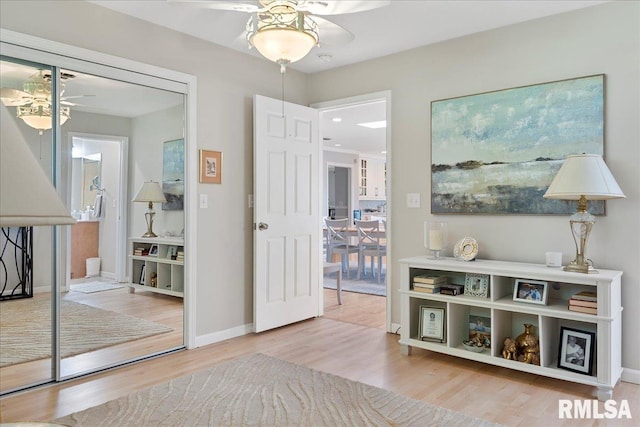 interior space with hardwood / wood-style flooring and ceiling fan