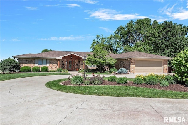 single story home featuring a garage