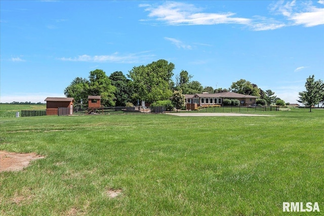 view of yard with a rural view