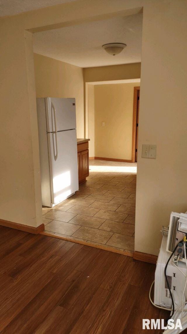 corridor featuring wood-type flooring