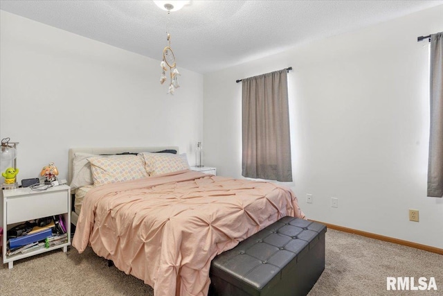 bedroom with carpet and a textured ceiling