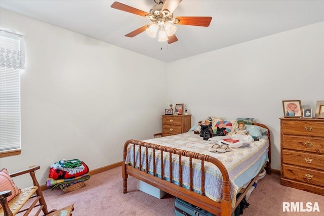 bedroom with ceiling fan and light colored carpet