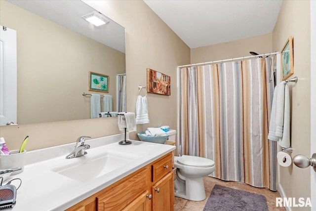 bathroom featuring walk in shower, tile patterned flooring, vanity, and toilet