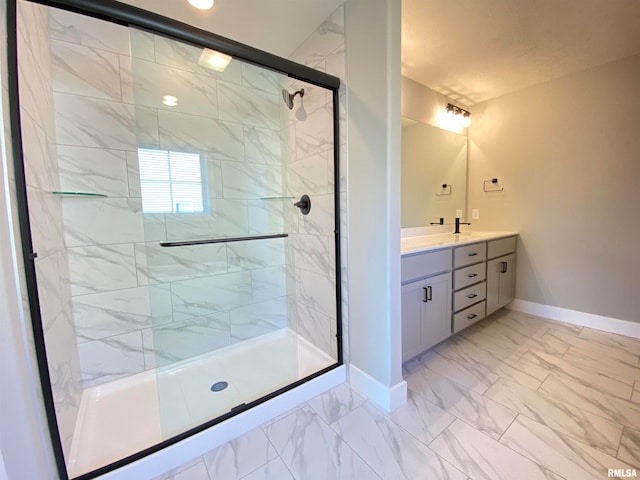 bathroom featuring vanity and a shower with shower door