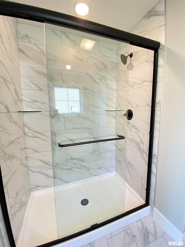 bathroom featuring an enclosed shower