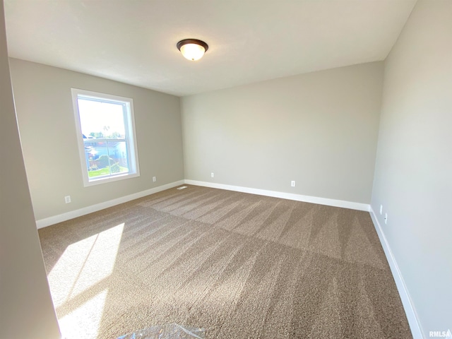 spare room featuring carpet flooring