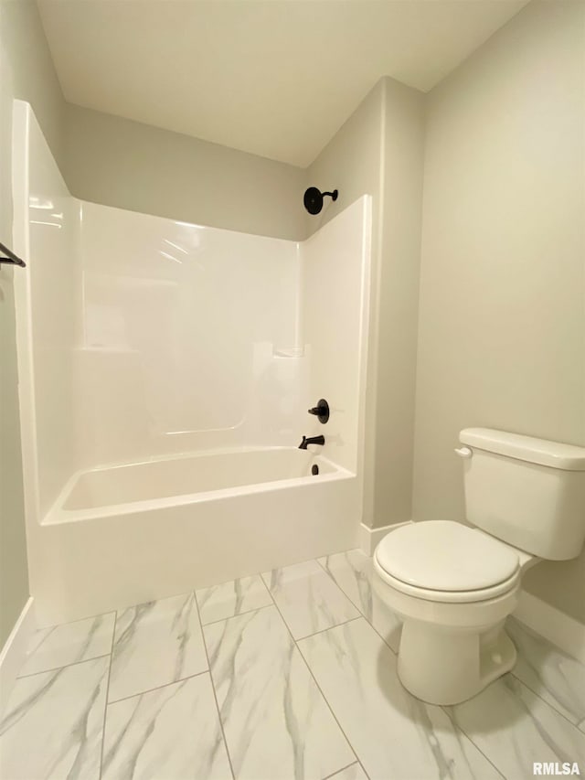 bathroom with shower / bathing tub combination and toilet