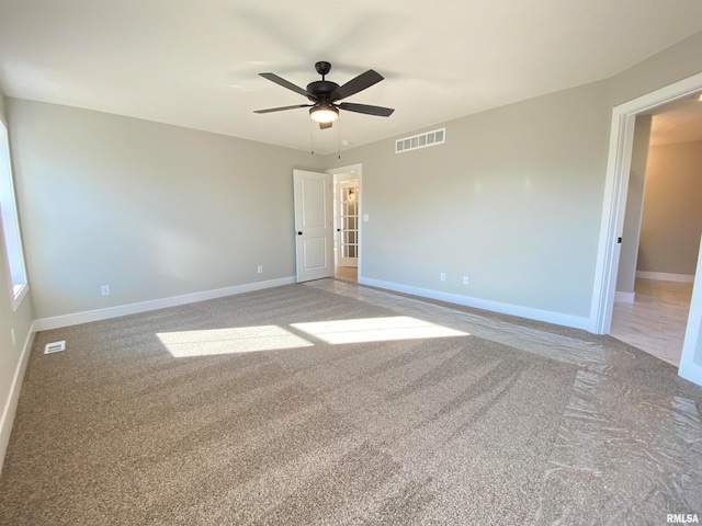 unfurnished room featuring ceiling fan