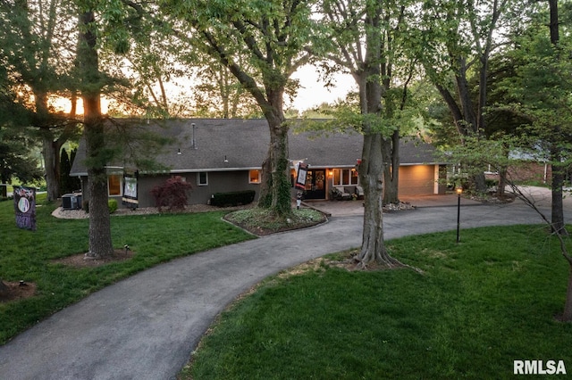 view of front of house with a yard