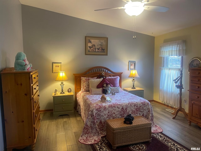 bedroom with light wood-type flooring and ceiling fan