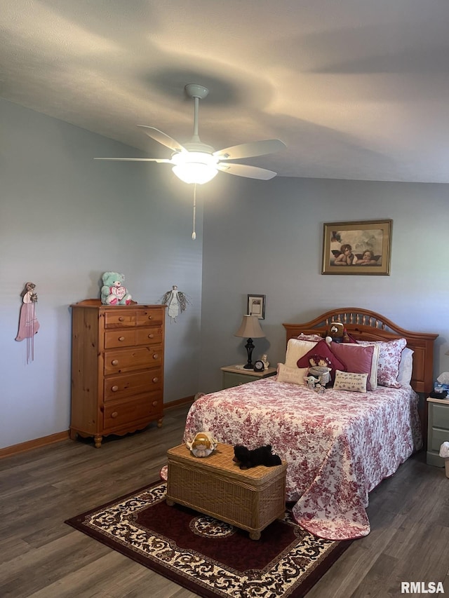 bedroom with dark wood-type flooring, ceiling fan, and lofted ceiling