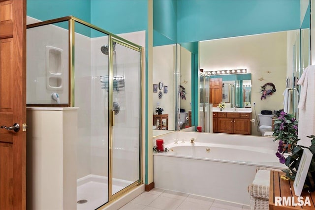 full bathroom with independent shower and bath, tile patterned floors, vanity, and toilet