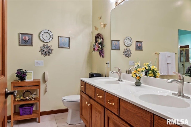 bathroom with walk in shower, tile patterned flooring, vanity, and toilet