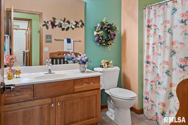 5001 Wildcat Run, Springfield, IL 62711 - full bath featuring vanity, tile patterned flooring, toilet, a shower with shower curtain, and baseboards