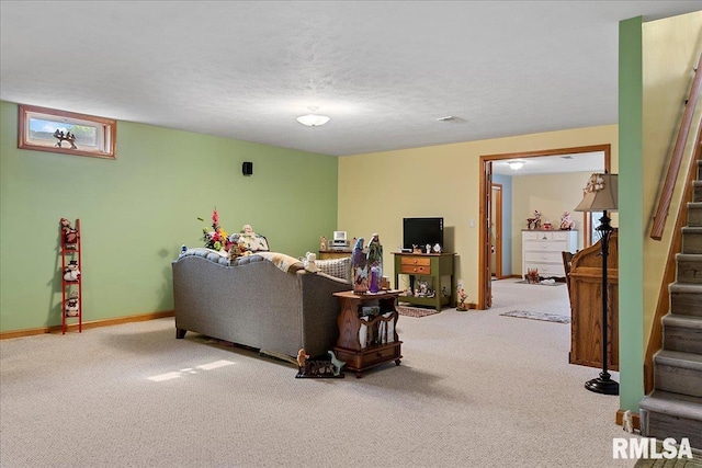 living room with a textured ceiling and carpet floors