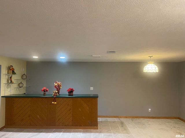 interior space featuring a textured ceiling