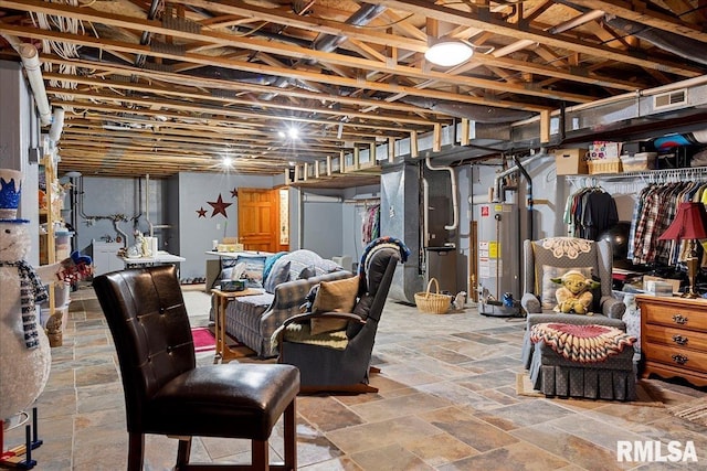 basement featuring water heater and heating unit